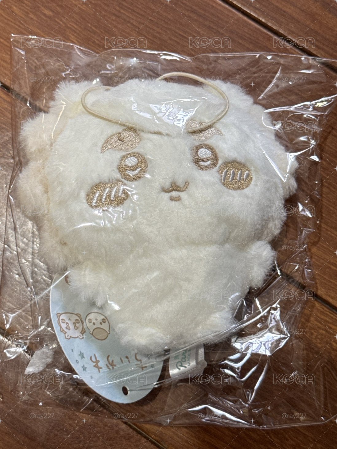 獅薩牛奶色吊飾娃