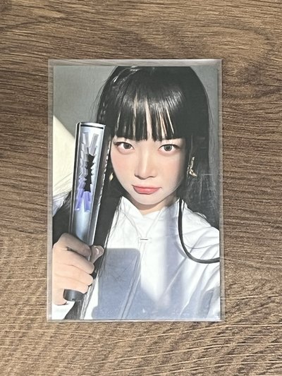 入場採
